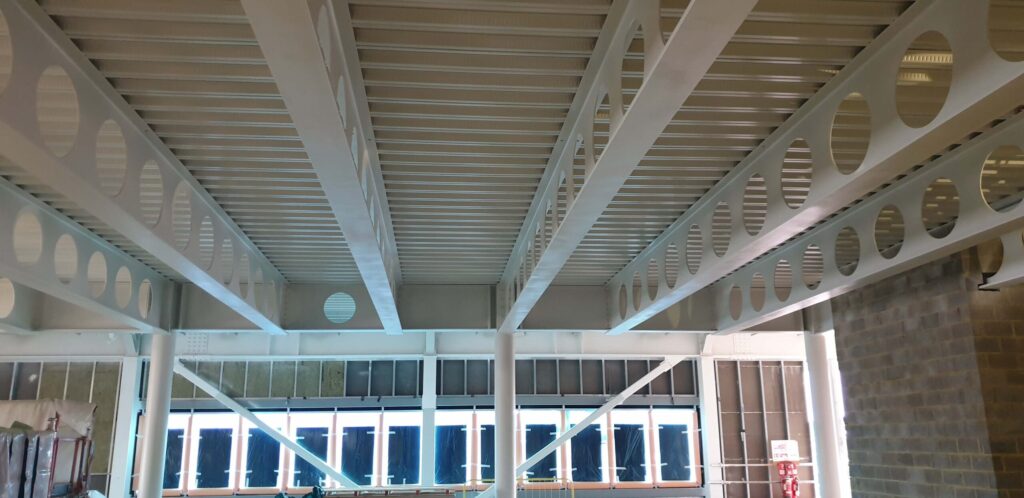Steel beam intumescent paint covering in Leisure Centre in New Addington